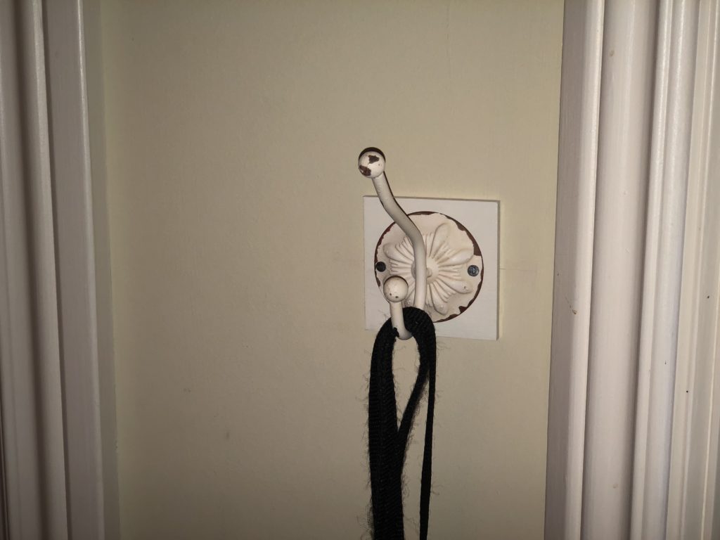 Hook mounted on wall.